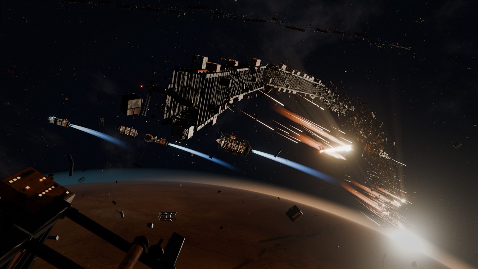 A broken orbital ring arcs above a dark rust-colored planet at sunrise, its far sections burning into the atmosphere, while a tiny convoy of salvage ships with blue engine trails slips through the wreckage.